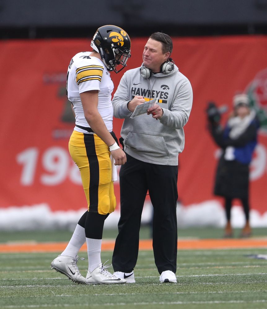 Iowa Hawkeyes offensive coordinator Brian Ferentz talks with quarterback Nate Stanley (4) against the Illinois Fighting Illini Saturday, November 17, 2018 at Memorial Stadium in Champaign, Ill. (Brian Ray/hawkeyesports.com)