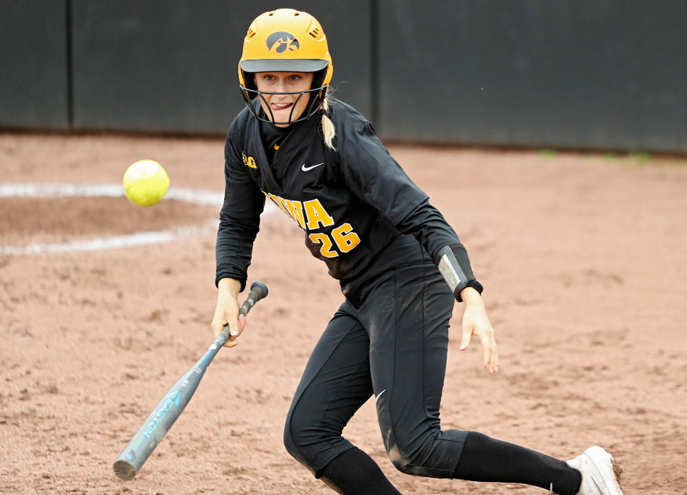 Iowa infielder Mia Ruther (26) lays down a bunt single which drives in a run during the fourth inning of their game against Iowa Softball vs Indian Hills Community College at Pearl Field in Iowa City on Sunday, Oct 6, 2019. (Stephen Mally/hawkeyesports.com)