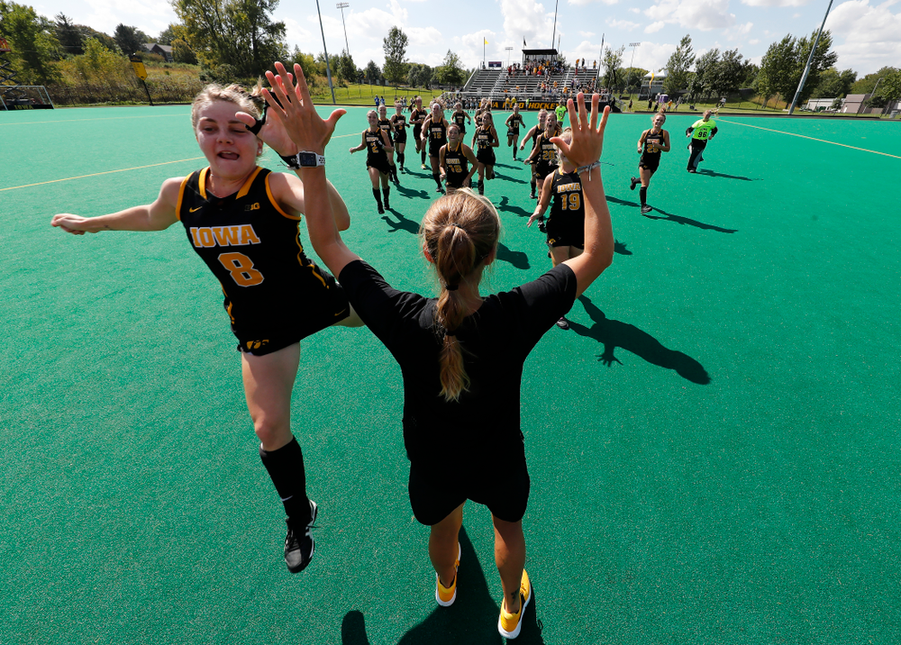 Iowa Hawkeyes Nikki Freeman (8) high fives assistant coach Roz Ellis before their game against the Penn Quakers Friday, September 14, 2018 at Grant Field. (Brian Ray/hawkeyesports.com)