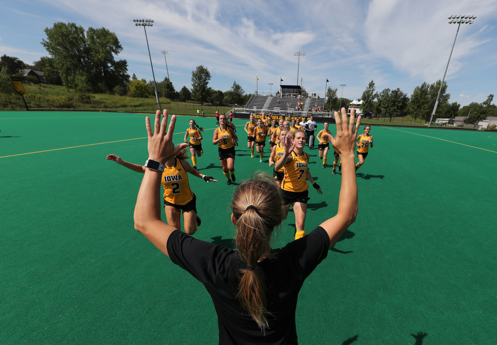 Iowa Hawkeyes defenseman Emily Deuell (2), Ellie Holley (7), and Iowa Hawkeyes assistant coach Roz Ellis during an exhibition game against Northwestern Saturday, August 24, 2019 at Grant Field. (Brian Ray/hawkeyesports.com)