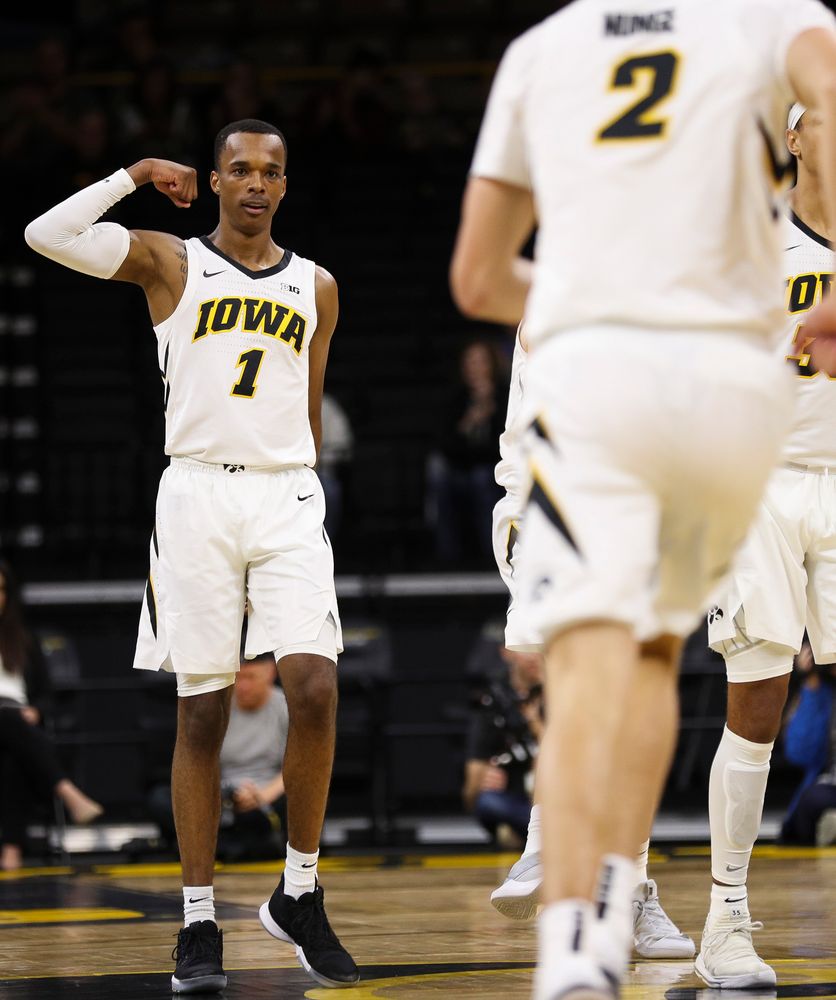 Iowa Hawkeyes guard Maishe Dailey (1) flexes to Iowa Hawkeyes forward Jack Nunge (2) after Nunge's first half dunk during a game against Guilford College at Carver-Hawkeye Arena on November 4, 2018. (Tork Mason/hawkeyesports.com)