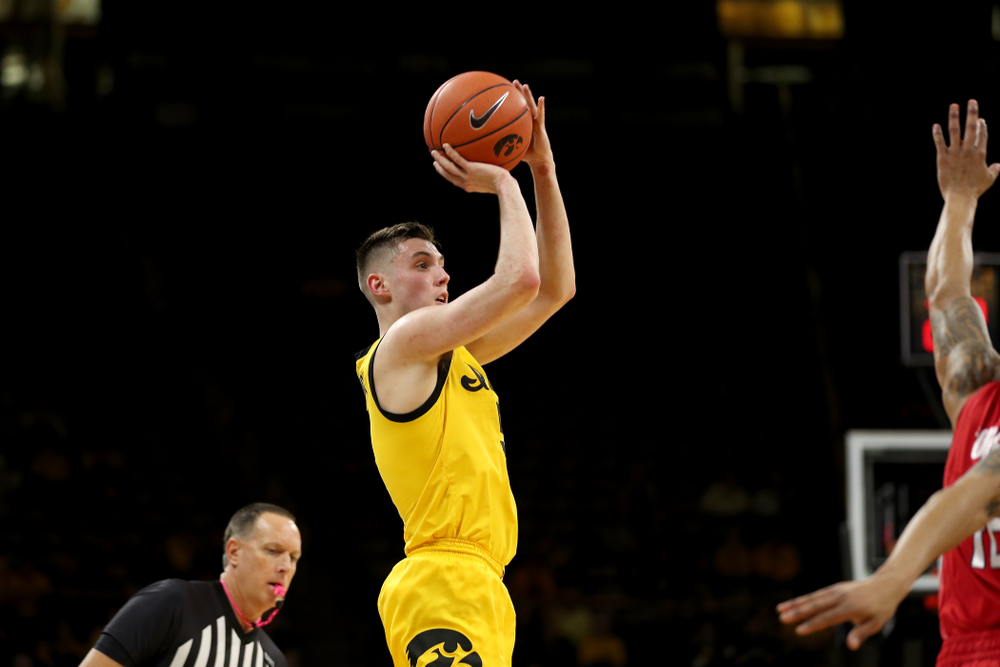 Iowa Hawkeyes guard CJ Fredrick (5) knocks down a three point basket against the Rutgers Scarlet Knights Wednesday, January 22, 2020 at Carver-Hawkeye Arena. (Brian Ray/hawkeyesports.com)