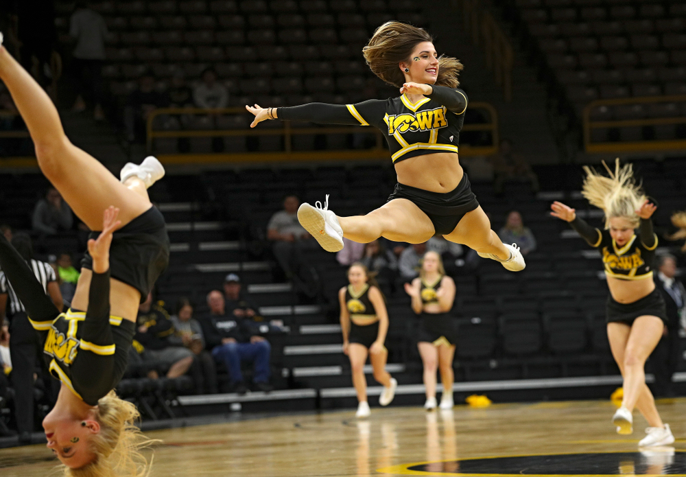 The Iowa Dance Team makes their way down the court during the fourth quarter of their game against Winona State at Carver-Hawkeye Arena in Iowa City on Sunday, Nov 3, 2019. (Stephen Mally/hawkeyesports.com)