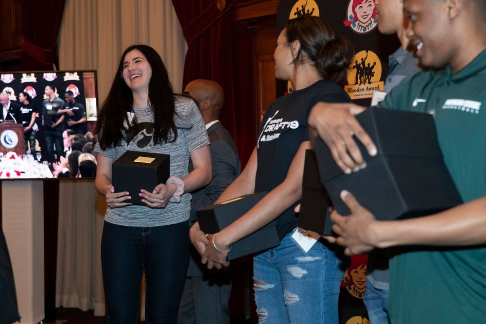 Iowa Hawkeyes forward Megan Gustafson (10) receives her trophy for being a Wooden Award finalist during the Wooden Award DukeÕs Dinner Thursday, April 11, 2019 at the LA Athletic Club. (Brian Ray/hawkeyesports.com)