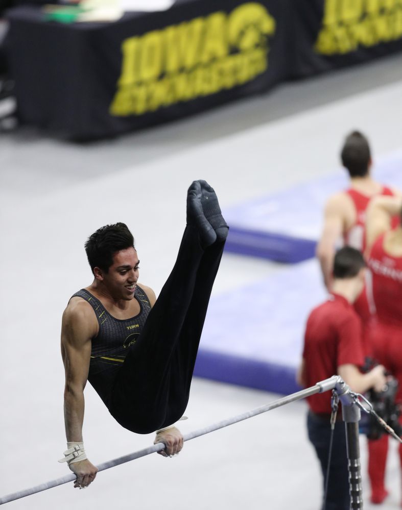 Iowa's Andrew Herrador competes on the high bar against Oklahoma Saturday, February 9, 2019 at Carver-Hawkeye Arena. (Brian Ray/hawkeyesports.com)