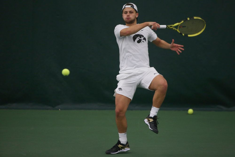Iowa’s Will Davies returns a hit during the Iowa men’s tennis meet vs Nebraska on Sunday, March 1, 2020 at the Hawkeye Tennis and Recreation Complex. (Lily Smith/hawkeyesports.com)
