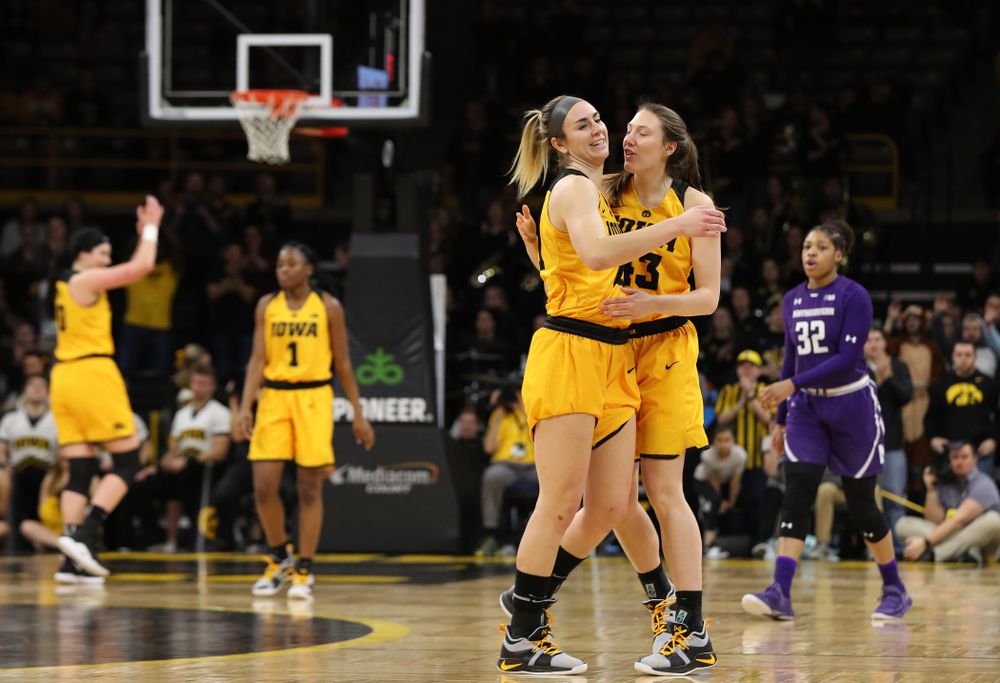 Iowa Hawkeyes forward Hannah Stewart (21) and forward Amanda Ollinger (43) against the Northwestern Wildcats Sunday, March 3, 2019 at Carver-Hawkeye Arena. (Brian Ray/hawkeyesports.com)