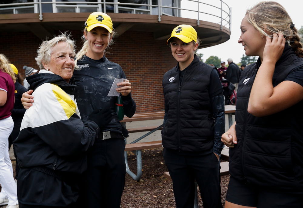 Former Iowa women's golf head coach Diane Thomason talks with Iowa's Shawn Rennegarbe, Brett Permann and Stephanie Herzog after the final round of the Diane Thomason Invitational at Finkbine Golf Course on September 30, 2018. (Tork Mason/hawkeyesports.com)
