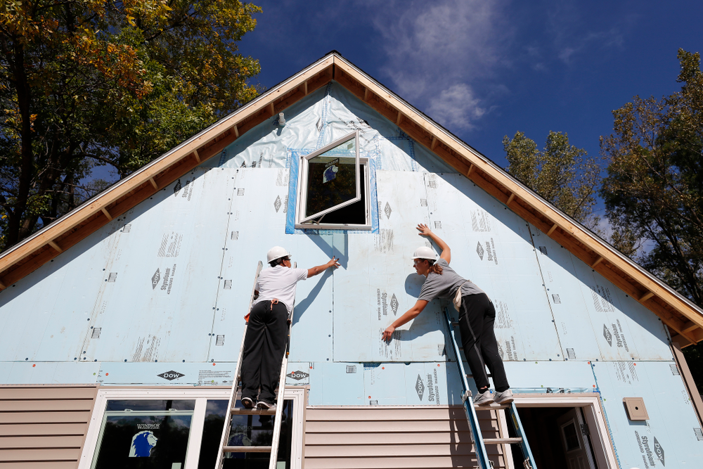 Iowa Hawkeyes guard Tania Davis (11) and forward/center Paula Valino Ramos (31) work on the Habitat for Humanity Women's Build Wednesday, September 26, 2018 in Iowa City. (Brian Ray/hawkeyesports.com)
