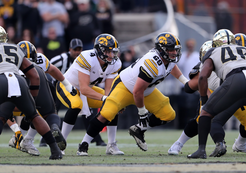Iowa Hawkeyes offensive lineman Keegan Render (69) and quarterback Nate Stanley (4) against the Purdue Boilermakers Saturday, November 3, 2018 Ross Ade Stadium in West Lafayette, Ind. (Brian Ray/hawkeyesports.com)
