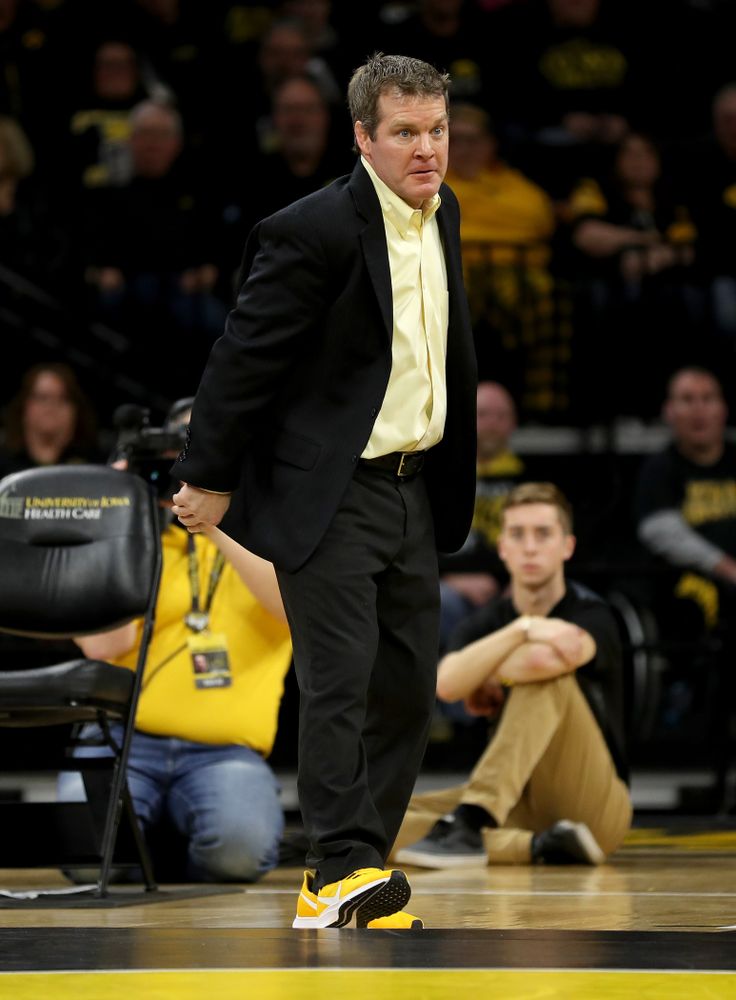 Head Coach Tom Brands works the edge of the mat as Iowa’s Michael Kemerer wrestles Ohio State’s Kaleb Romero at 174 pounds Friday, January 24, 2020 at Carver-Hawkeye Arena. Kemerer won the match 7-1. (Brian Ray/hawkeyesports.com)