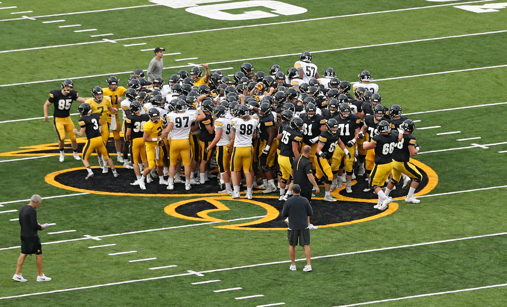 The Iowa Hawkeyes huddle on the Tigerhawk during Fall Camp Practice No. 12 at Kinnick Stadium in Iowa City on Thursday, Aug 15, 2019. (Stephen Mally/hawkeyesports.com)