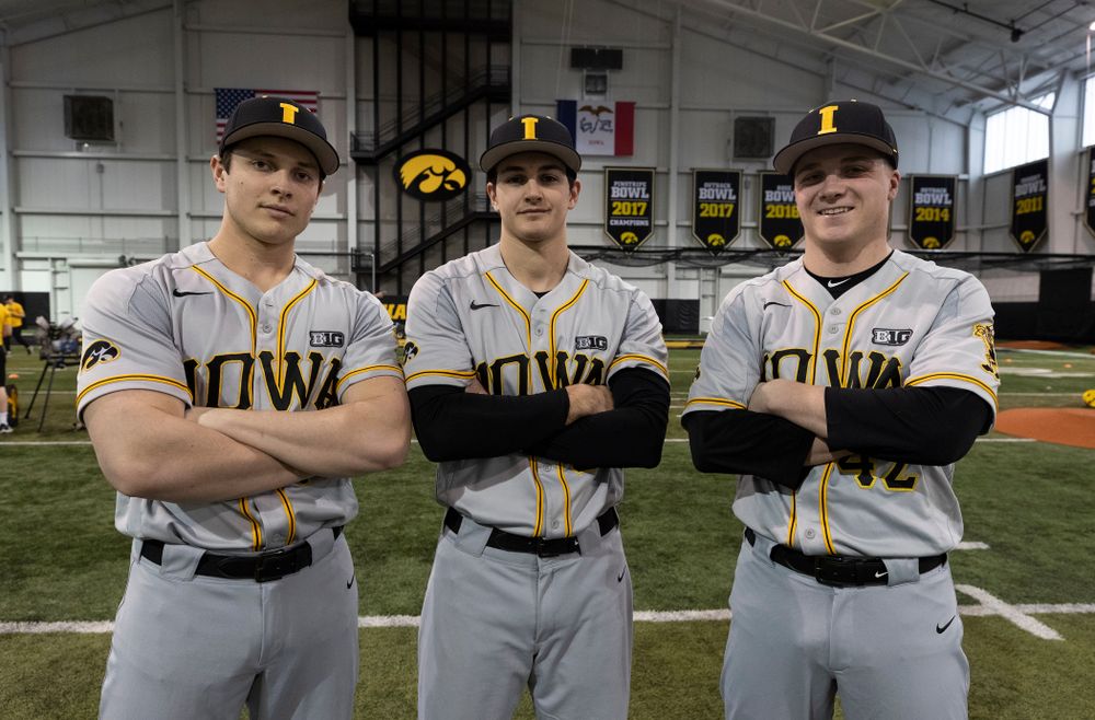 Iowa Hawkeyes pitchers Ben Probst (19), Jason Foster (27), and Trace Hoffman (42) pose for a photo during the team's annual media day Tuesday, February 5, 2019 in the Indoor Practice Facility. (Brian Ray/hawkeyesports.com)
