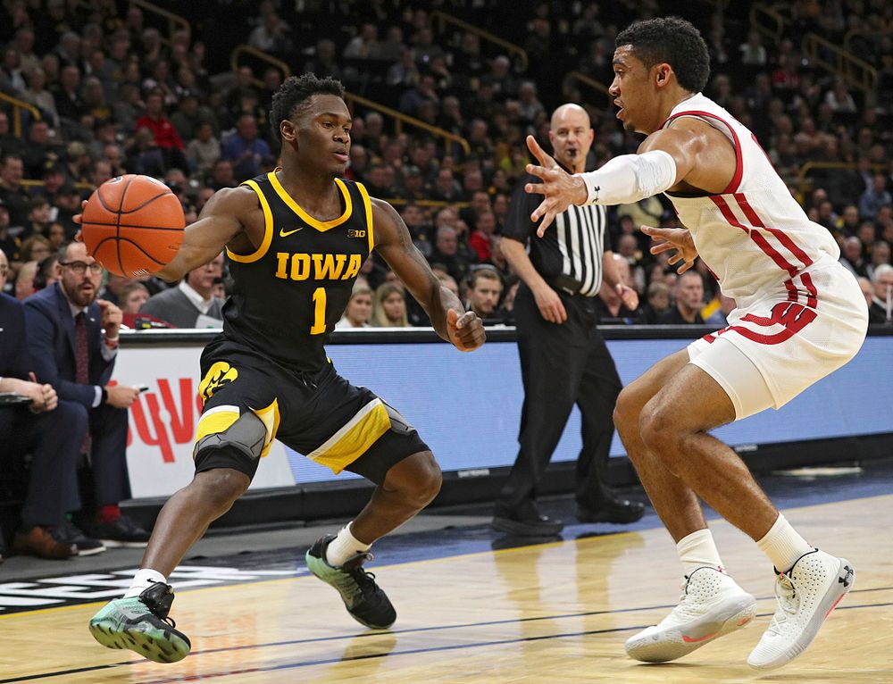 Iowa Hawkeyes guard Joe Toussaint (1) passes the ball during the first half of their game at Carver-Hawkeye Arena in Iowa City on Monday, January 27, 2020. (Stephen Mally/hawkeyesports.com)