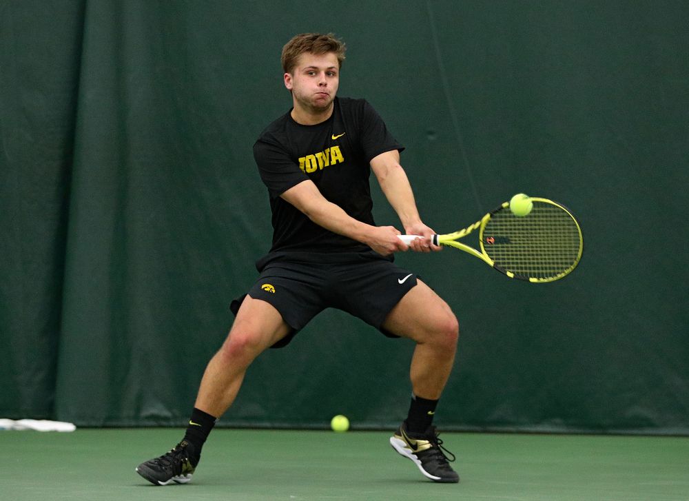 Iowa’s Will Davies returns a shot during his singles match at the Hawkeye Tennis and Recreation Complex in Iowa City on Friday, March 6, 2020. (Stephen Mally/hawkeyesports.com)