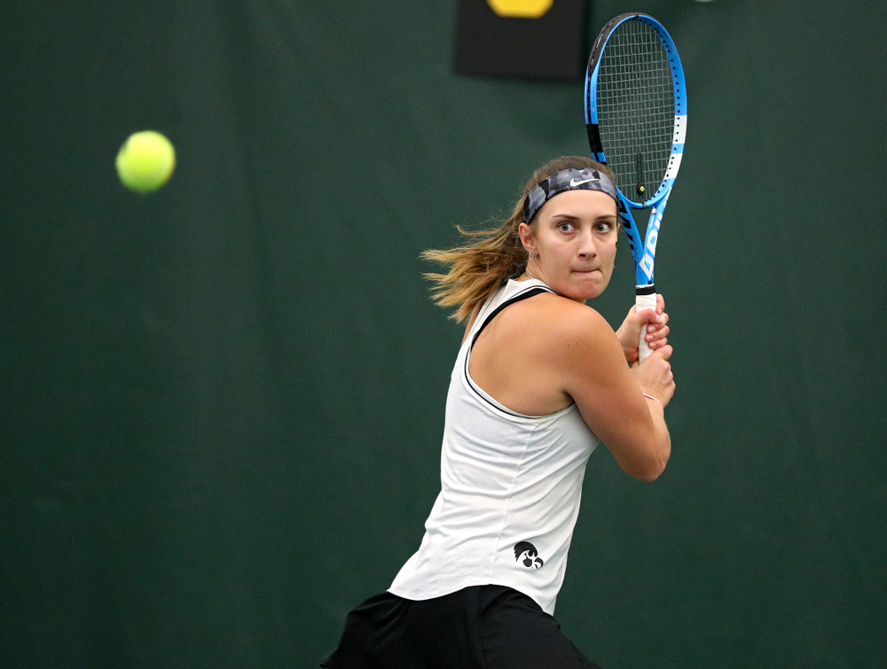 Iowa’s Ashleigh Jacobs returns a shot during her singles match at the Hawkeye Tennis and Recreation Complex in Iowa City on Sunday, February 16, 2020. (Stephen Mally/hawkeyesports.com)