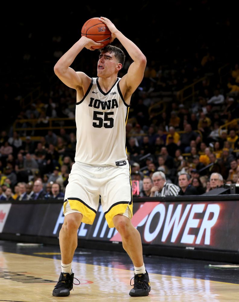 Iowa Hawkeyes forward Luka Garza (55) knocks down a three point basket against the Michigan Wolverines Friday, January 17, 2020 at Carver-Hawkeye Arena. (Brian Ray/hawkeyesports.com)