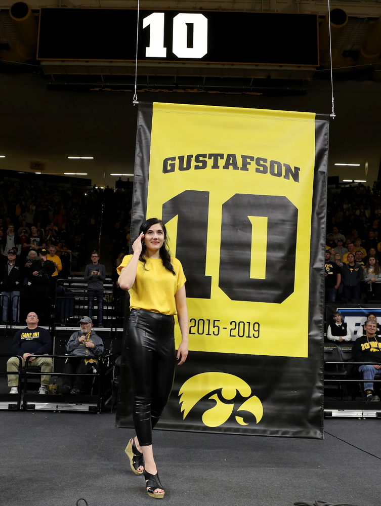 Megan Gustafson stands with her family as her number is raised into the rafters during a jersey retirement ceremony Sunday, January 26, 2020 at Carver-Hawkeye Arena. (Brian Ray/hawkeyesports.com)