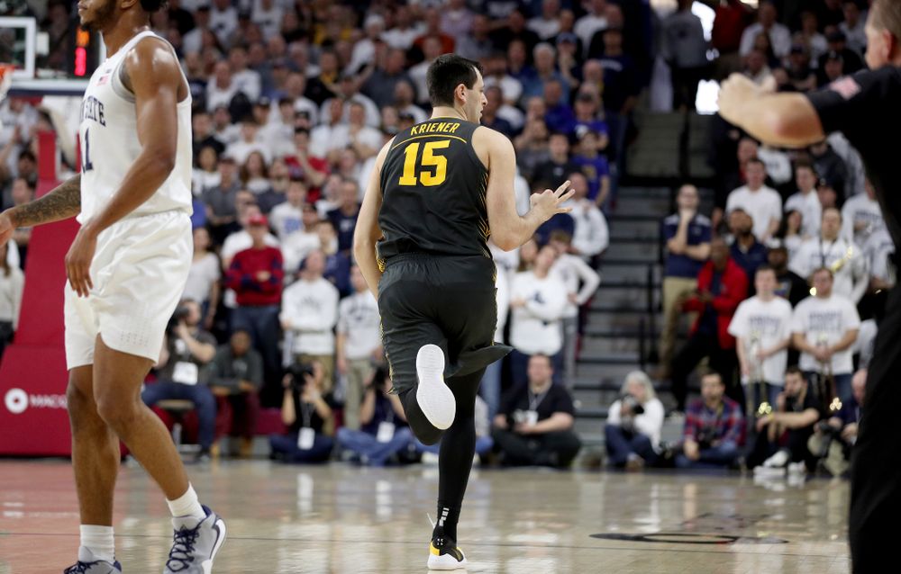 Iowa Hawkeyes forward Ryan Kriener (15) celebrates a three point basket against Penn State Friday, January 3, 2020 at the Palestra in Philadelphia. (Brian Ray/hawkeyesports.com)