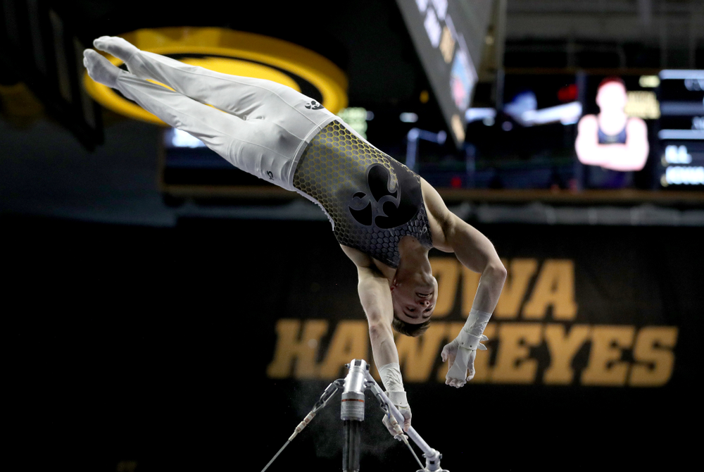 Iowa’s Mitch Mandozzi competes on the high bar against Illinois Sunday, March 1, 2020 at Carver-Hawkeye Arena. (Brian Ray/hawkeyesports.com)