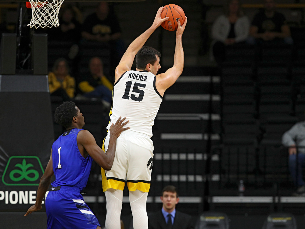 Iowa Hawkeyes forward Ryan Kriener (15) pulls down a rebound during the first half of their exhibition game against Lindsey Wilson College at Carver-Hawkeye Arena in Iowa City on Monday, Nov 4, 2019. (Stephen Mally/hawkeyesports.com)