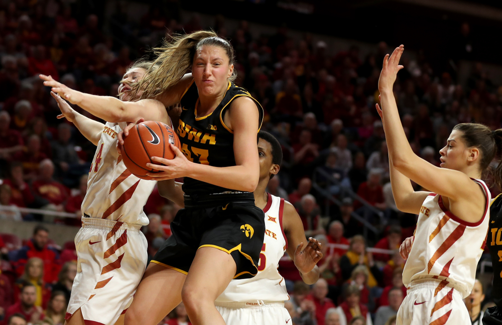 Iowa Hawkeyes forward Amanda Ollinger (43) grabs a rebound against the Iowa State Cyclones Wednesday, December 11, 2019 at Hilton Coliseum in Ames, Iowa(Brian Ray/hawkeyesports.com)