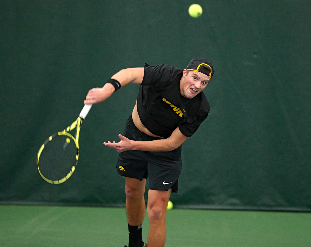 Iowa’s Joe Tyler returns a shot during their match at the Hawkeye Tennis and Recreation Complex in Iowa City on Thursday, January 16, 2020. (Stephen Mally/hawkeyesports.com)