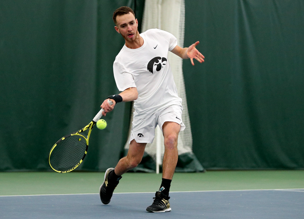 Iowa’s Kareem Allaf returns a shot during his singles match at the Hawkeye Tennis and Recreation Complex in Iowa City on Sunday, February 16, 2020. (Stephen Mally/hawkeyesports.com)
