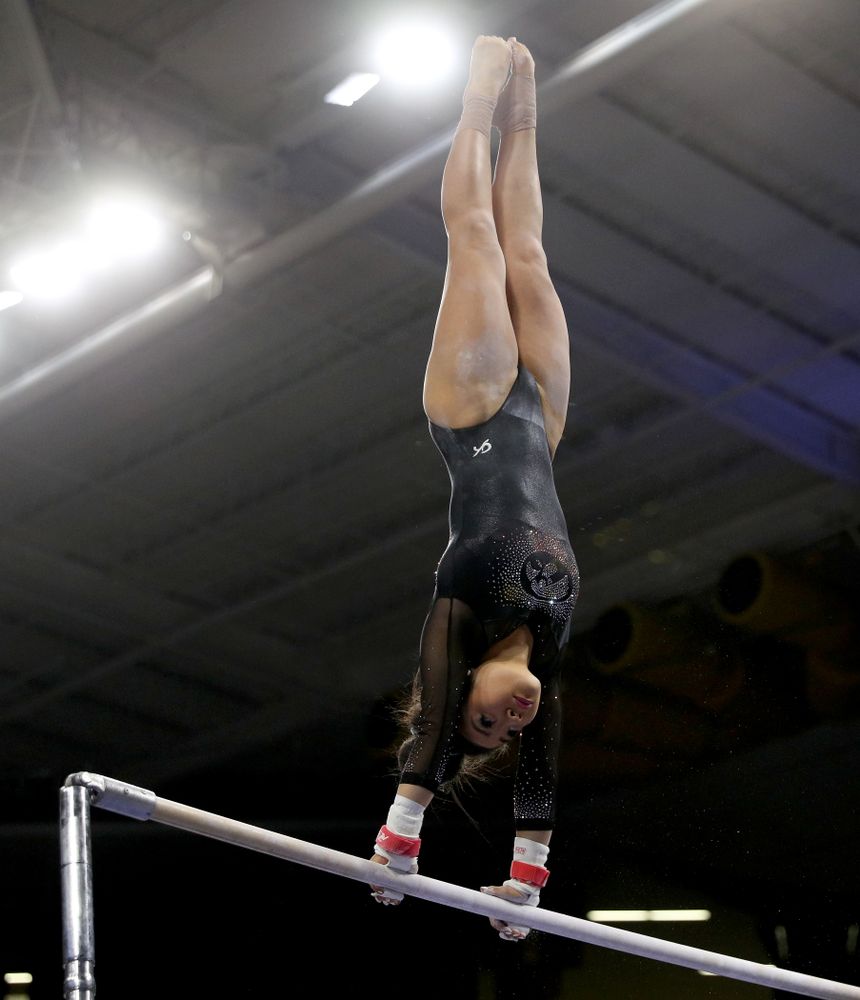 Iowa’s Clair Kaji competes on the bars against Michigan Friday, February 14, 2020 at Carver-Hawkeye Arena. (Brian Ray/hawkeyesports.com)