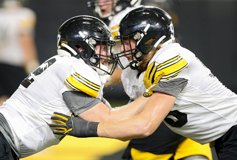 Iowa Hawkeyes defensive lineman John Waggoner (from left) and defensive lineman Chris Reames work on a drill during Fall Camp Practice No. 9 at the Hansen Football Performance Center in Iowa City on Monday, Aug 12, 2019. (Stephen Mally/hawkeyesports.com)