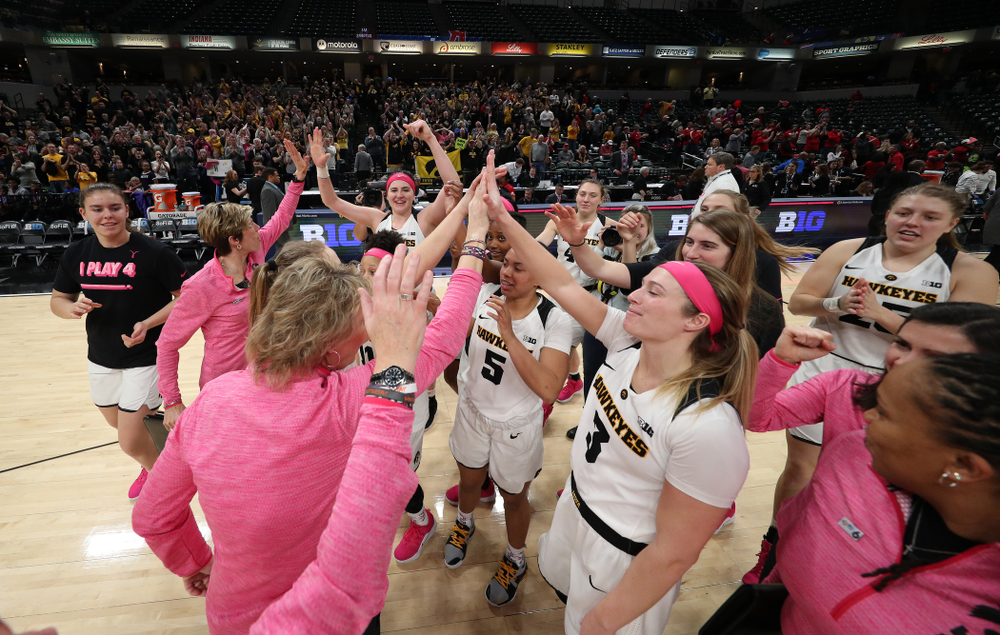 The Iowa Hawkeyes celebrate their win against the Rutgers Scarlet Knights in the semi-finals of the Big Ten Tournament Saturday, March 9, 2019 at Bankers Life Fieldhouse in Indianapolis, Ind. (Brian Ray/hawkeyesports.com)