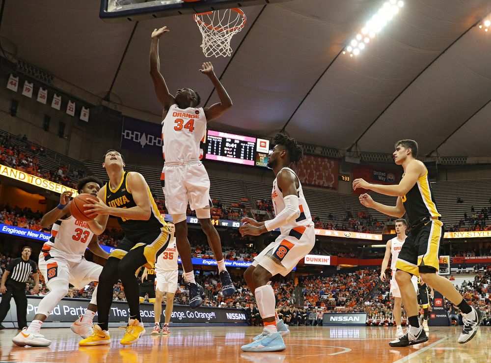 Iowa Hawkeyes forward Ryan Kriener (15) waits for Syracuse Orange forward Bourama Sidibe (34) to clear before making a basket during the first half of their ACC/Big Ten Challenge game at the Carrier Dome in Syracuse, N.Y. on Tuesday, Dec 3, 2019. (Stephen Mally/hawkeyesports.com)