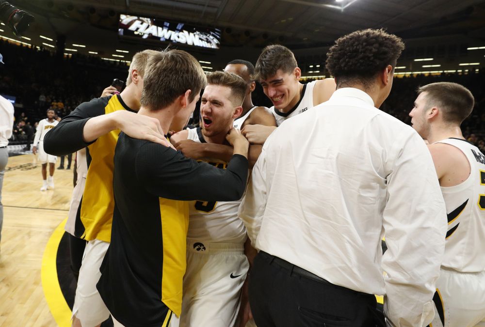 Iowa Hawkeyes guard Jordan Bohannon (3) celebrates with his teammates after making the game winning three point basket against the Northwestern Wildcats Sunday, February 10, 2019 at Carver-Hawkeye Arena. (Brian Ray/hawkeyesports.com)