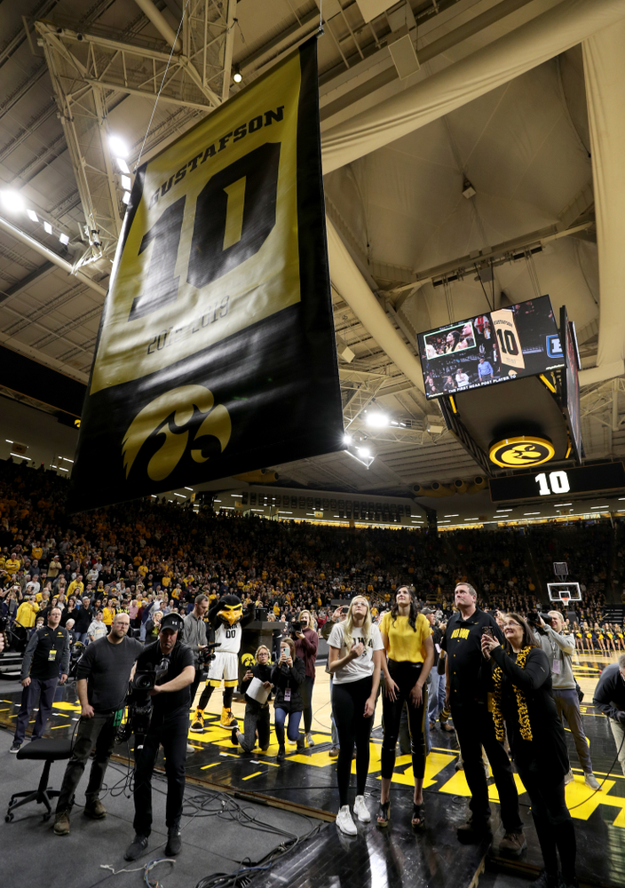 Megan Gustafson stands with her family as her number is raised into the rafters during a jersey retirement ceremony Sunday, January 26, 2020 at Carver-Hawkeye Arena. (Brian Ray/hawkeyesports.com)