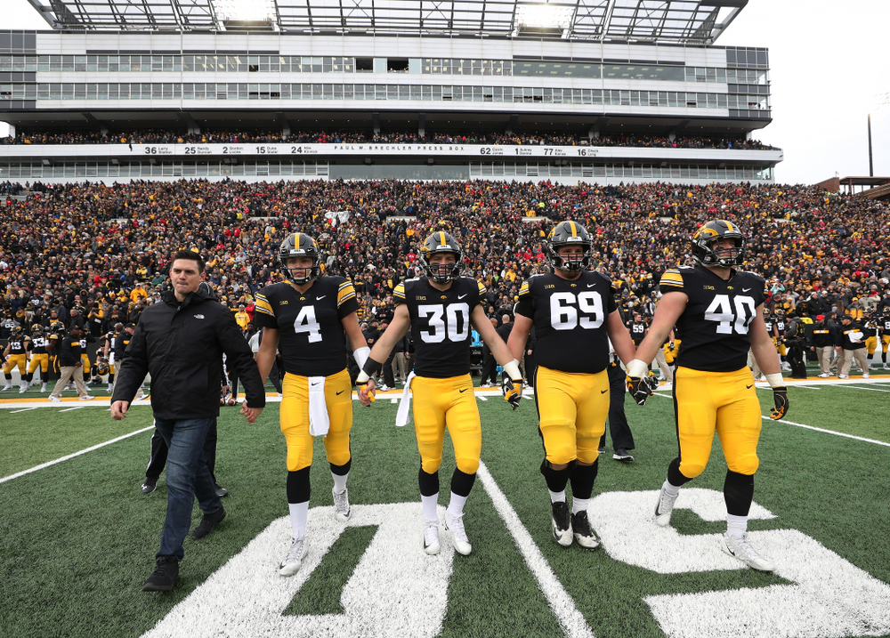Iowa Hawkeyes captains James Morris, quarterback Nate Stanley (4), defensive back Jake Gervase (30), offensive lineman Keegan Render (69), and defensive end Parker Hesse (40) before their game against the Nebraska Cornhuskers Friday, November 23, 2018 at Kinnick Stadium. (Brian Ray/hawkeyesports.com)