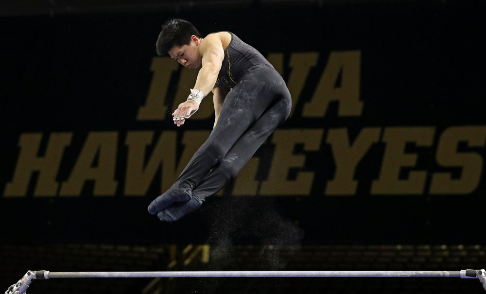 Iowa's Bennet Huang competes in the horizontal bar during the first day of the Big Ten Men's Gymnastics Championships at Carver-Hawkeye Arena in Iowa City on Friday, Apr. 5, 2019. (Stephen Mally/hawkeyesports.com)