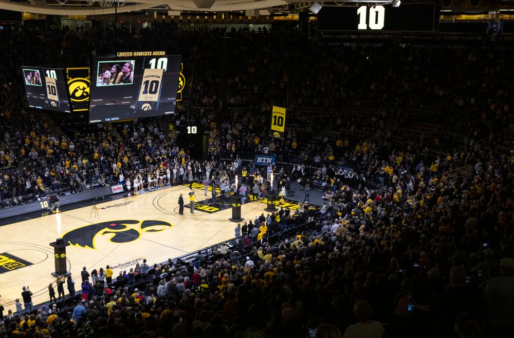 Megan Gustafson stands with her family as her number is raised into the rafters during a jersey retirement ceremony Sunday, January 26, 2020 at Carver-Hawkeye Arena. (Brian Ray/hawkeyesports.com)