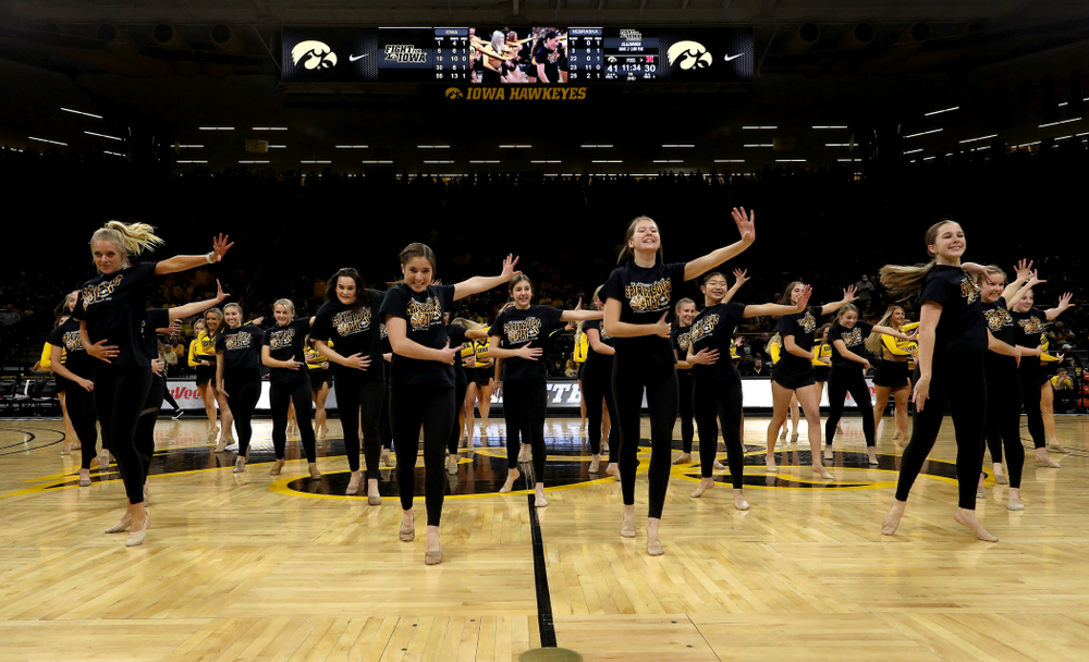 The Iowa Spirit Squad performs with participants in Spirit Squad Day at halftime of the Iowa Hawkeyes game against the Nebraska Cornhuskers Saturday, February 8, 2020 at Carver-Hawkeye Arena. (Brian Ray/hawkeyesports.com)