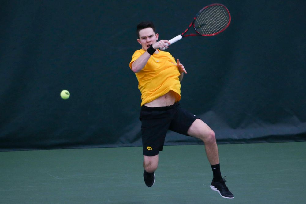 Iowa's Jonas Larsen at a tennis match vs Drake Friday, March 8, 2019 at the Hawkeye Tennis and Recreation Complex. (Lily Smith/hawkeyesports.com)