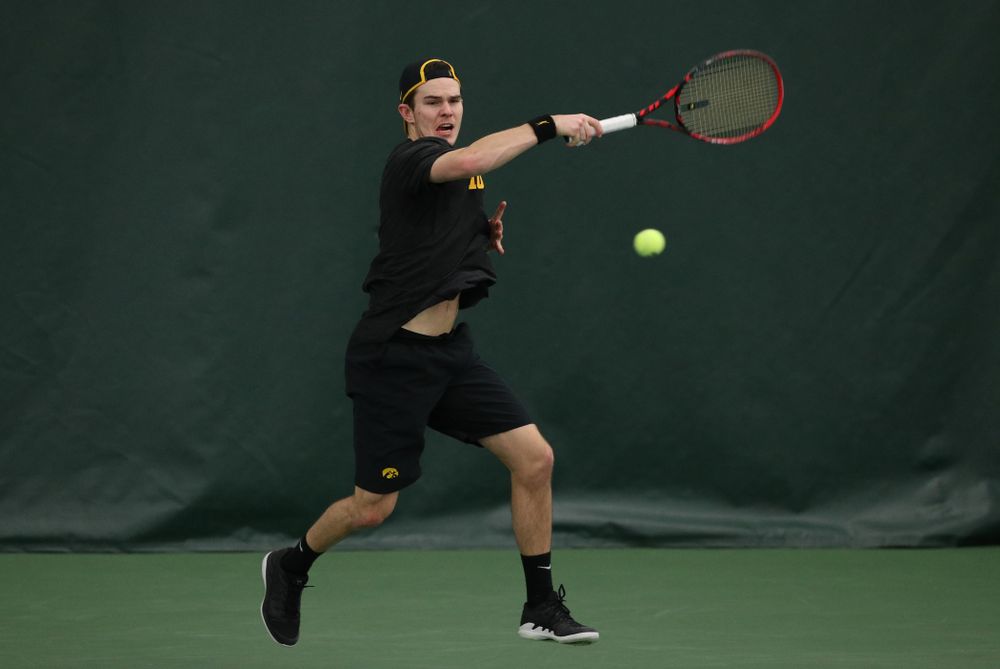 Iowa's Jonas Larsen against UMKC Friday, February 15, 2019 at the Hawkeye Tennis and Recreation Complex. (Brian Ray/hawkeyesports.com)
