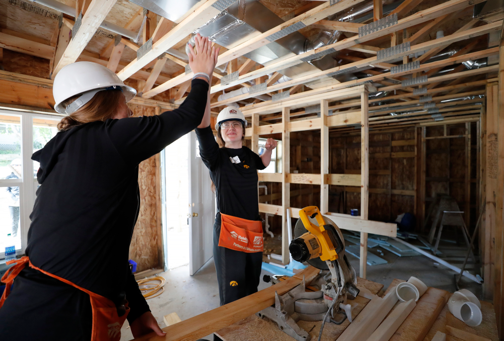 Iowa Hawkeyes forward Megan Gustafson (10) and Iowa Hawkeyes forward/center Monika Czinano (25) work on the Habitat for Humanity Women's Build Wednesday, September 26, 2018 in Iowa City. (Brian Ray/hawkeyesports.com)