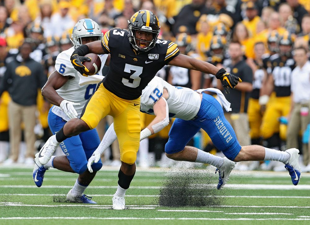 Iowa Hawkeyes wide receiver Tyrone Tracy Jr. (3) spins away from a defender after pulling in a pass during third quarter of their game at Kinnick Stadium in Iowa City on Saturday, Sep 28, 2019. (Stephen Mally/hawkeyesports.com)