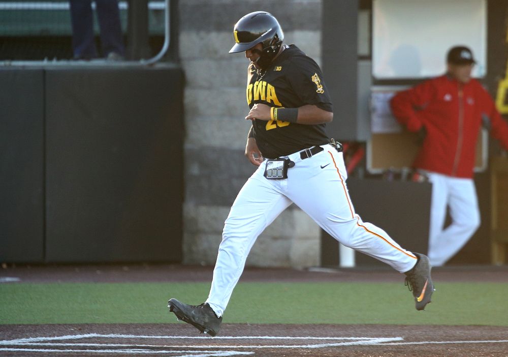 Iowa infielder Izaya Fullard (20) scores a run during the third inning of their game at Duane Banks Field in Iowa City on Tuesday, March 3, 2020. (Stephen Mally/hawkeyesports.com)