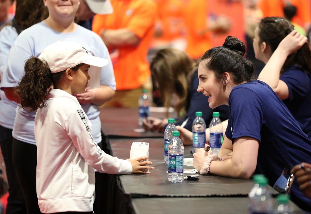 Iowa Hawkeyes forward Megan Gustafson (10) signs autographs with the other WBCA All Americans at the Tourney Town Fan Fest Friday, April 5, 2019 at the Tampa Convention Center in Tampa, FL. (Brian Ray/hawkeyesports.com)