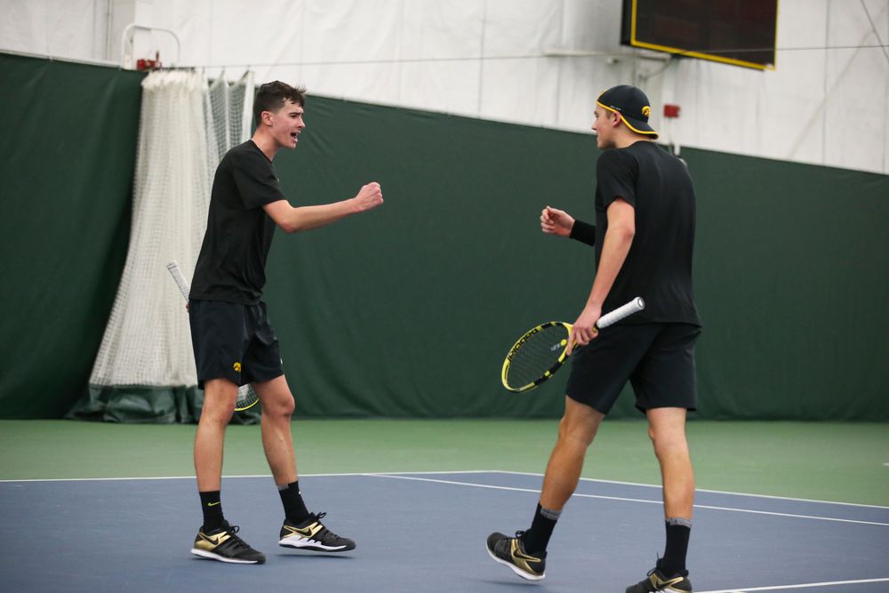 Iowa’s Matt Clegg and Joe Tyler celebrate a point during the Iowa men’s tennis meet vs VCU on Saturday, February 29, 2020 at the Hawkeye Tennis and Recreation Complex. (Lily Smith/hawkeyesports.com)