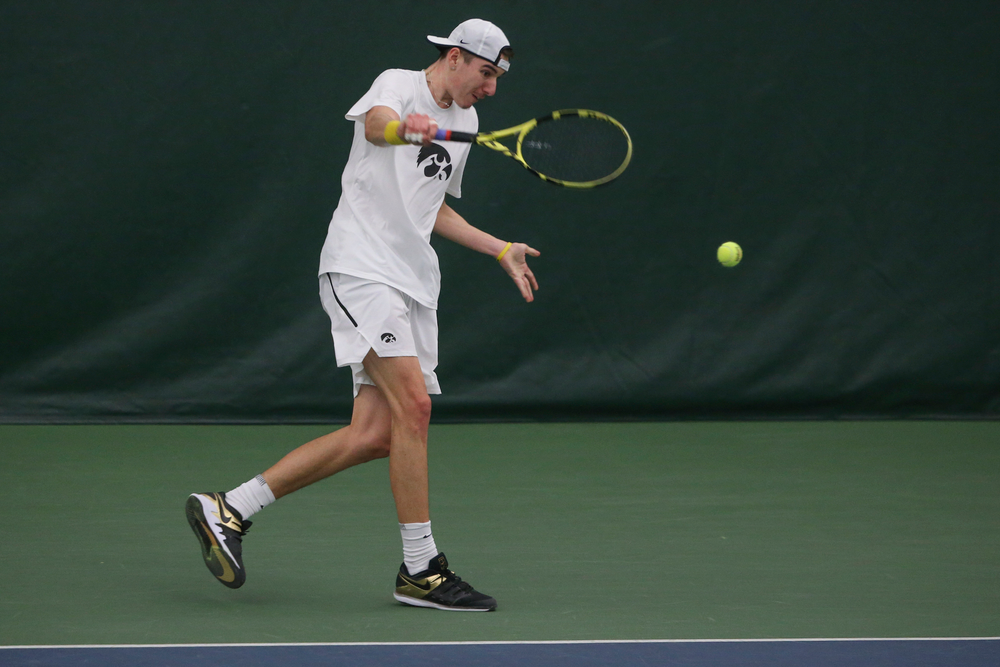 Iowa’s Nikita Snezhko returns a hit during the Iowa men’s tennis meet vs Nebraska on Sunday, March 1, 2020 at the Hawkeye Tennis and Recreation Complex. (Lily Smith/hawkeyesports.com)