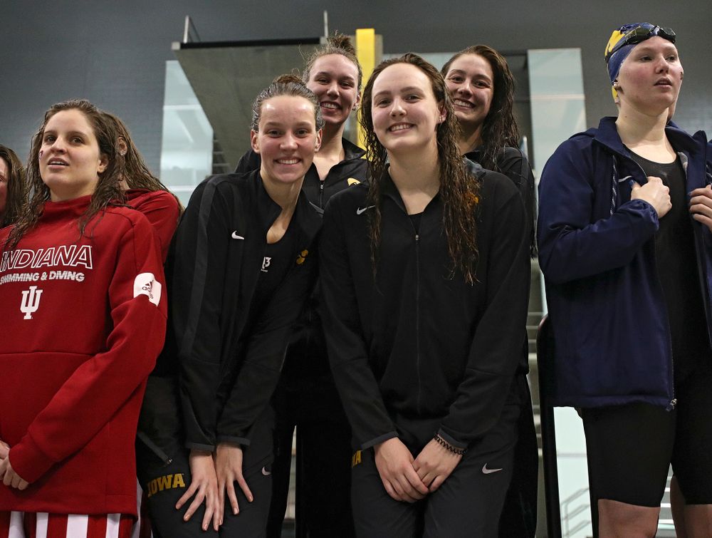 Iowa’s Hannah Burvill, Allyssa Fluit, Emilia Sansome, and Macy Rink on the podium after placing fourth in the 800 yard freestyle relay event during the 2020 Big Ten Women’s Swimming and Diving Championships at the Campus Recreation and Wellness Center in Iowa City on Wednesday, February 19, 2020. (Stephen Mally/hawkeyesports.com)