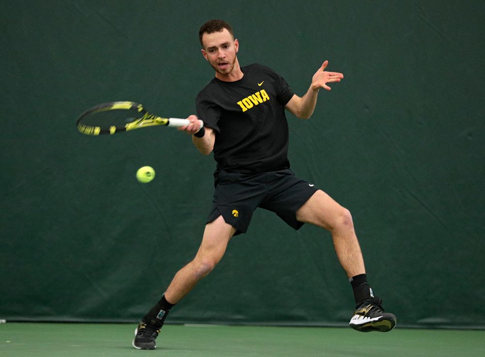 Iowa’s Kareem Allaf returns a shot during his singles match at the Hawkeye Tennis and Recreation Complex in Iowa City on Friday, March 6, 2020. (Stephen Mally/hawkeyesports.com)