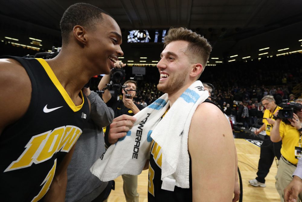 Iowa Hawkeyes guard Jordan Bohannon (3) celebrates with guard Maishe Dailey (1) after defeating the Indiana Hoosiers in overtime Friday, February 22, 2019 at Carver-Hawkeye Arena. (Brian Ray/hawkeyesports.com)
