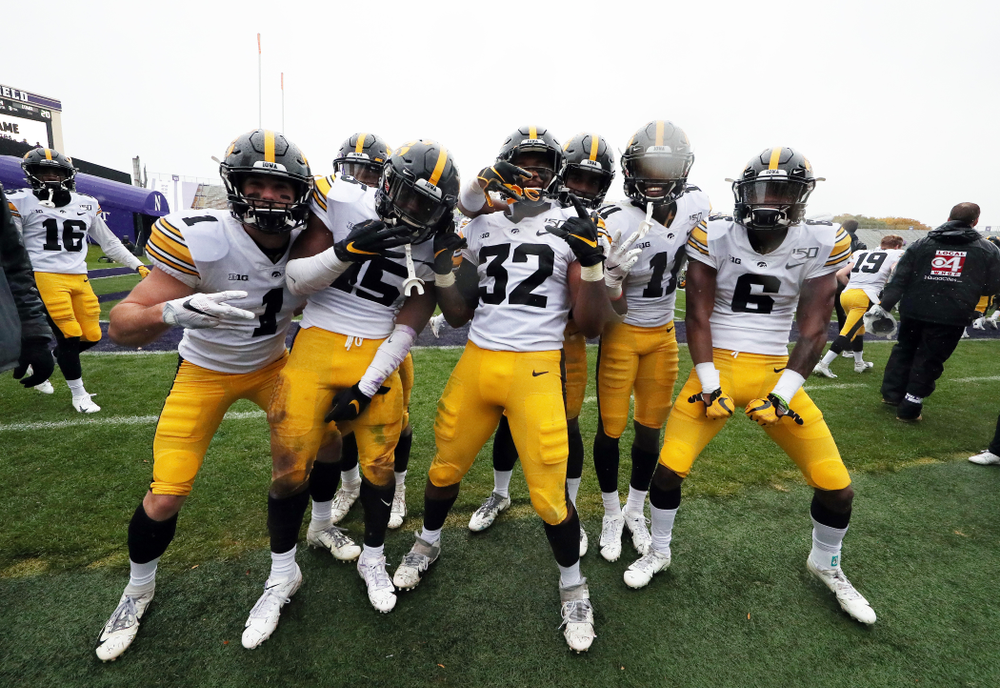 The Iowa Hawkeyes celebrate their victory against the Northwestern Wildcats Saturday, October 26, 2019 at Ryan Field in Evanston, Ill. (Brian Ray/hawkeyesports.com)
